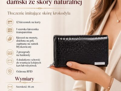 Czarny lakierowany portfel damski w dłoni, zamknięty, z tłoczeniem krokodyla, detal przodu